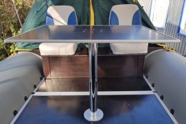 The table laminated on the chromeplated support in boat (84х63х58)